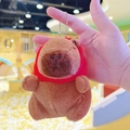 Close-up of a plush Capybara keychain wearing a tiny red hooded cape with silver chain - Strawberry Hat Dark Brown + Bead Chain