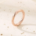 Polished rose gold 18k plated titanium steel ring on minimalist beige stone pedestal - US 6 / Thin Plain Band (3mm) / Rose Gold (KR34641-K)