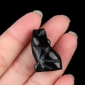 Hand-carved miniature black obsidian wolf figurine with detailed fur texture engraving - Obsidian