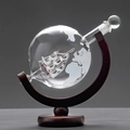 Detailed view of globe whiskey decanter with internal glass ship on a wooden stand - Single Bottle And Wood Stand