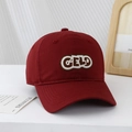 Detail of red cotton baseball cap featuring 3D embroidered GELO patch and contrast edging - Burgundy / 54cm (3-8 Years)