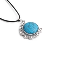 Close-up of a round turquoise pendant with sparkling rhinestones on a black cord - Blue Textured/Black Rope