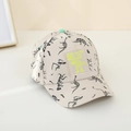 Detail of beige kids baseball cap featuring black dinosaur patterns and a green neon patch - 50-54 CM (Adjustable) / Khaki