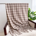 Detail of soft plaid scarf with tassels draped over a chair in a cozy setting - Brown & White Plaid (WT142-4)