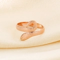 Macro shot of rose gold snake ring with realistic scale texture on champagne silk - Snake Design (KR105285)