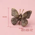 Solid brass butterfly ornament with antique finish showing 30.2mm height and wings detail - Small Butterfly Ornament