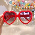 Cute red heart-shaped sunglasses for girls with dark lenses and glossy red frame - Red Heart