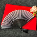 Classic Chinese folding fan with purple orchid pattern on a red gift box background - Fragrant Orchid