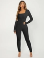 Detail of square neck yoga jumpsuit with thumbhole cuffs and ribbed knit texture - S / Black