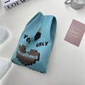 Light blue knitted tote bag featuring a pixelated brown heart and Sweetheart text - Double Sided Letters Cyan