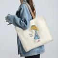 Cream canvas tote bag with colorful girl and cat illustration and brown straps - Straw Hat Girl - Beige