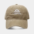 Close-up of white Captain embroidery and helm pattern on washed khaki baseball cap - Adjustable / Khaki