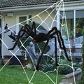 Ragno nero gigante con occhi rossi luminosi su una grande ragnatela per Halloween - Set di Ragnatela Luminosa