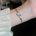 Close-up of heart-shaped opal and star charms on an elegant silver zircon bracelet - 17# Silver Heart Bracelet