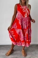 Detail of red sleeveless midi dress featuring pink floral print and layered skirt design - S / Bottoms / Red