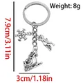 Silver Christmas keychain with snowflake, deer and ski boots charms, 8g weight - ER1805-Antique Silver Snowflake Deer Ski Boot Keychain