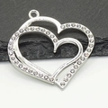 Detail of silver double heart pendant with sparkling crystals on a stone background - Large Heart Pendant / Silver