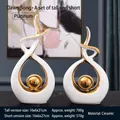 Sculture astratte moderne in ceramica bianca con bordi dorati per decoro casa - Canto del Mattino Bianco Oro Coppia
