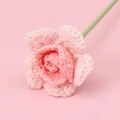 Close-up of handmade pink knitted yarn rose with detailed gradient texture and green stem - Single-headed Barbie Rose Stem - Gradient Pink