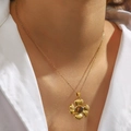 18K gold plated sunflower pendant necklace with amber gemstone on a white shirt - Vintage Flower (DJN009L)