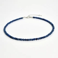 Close-up of 4mm dark blue natural stone beaded necklace with silver lobster clasp and chain - Blue Sesame Stone