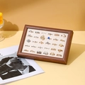 Walnut finish jewelry tray with beige velvet slots displaying gold and silver rings - Walnut/Beige