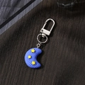 Close-up of blue moon keychain with yellow star detail and silver metal clasp - Moon (F523K)
