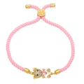 Handmade woven pink rope bracelet with a gold teddy bear charm and pink heart crystal - Pink