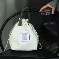 Cream canvas insulated lunch bag with dark green handles and adjustable crossbody strap - Off-white