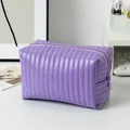 Purple quilted makeup bag in glossy PU leather with elegant vertical stitching details - Candy Leather Lavender
