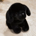 Cute black puppy plush toy featuring soft fluffy fur in a seated realistic puppy pose - Small Black