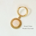 Gold hoop earrings featuring sunburst pendants with white marble texture center - White Jade Sunflower