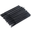 Bulk disposable eyelash brushes with black plastic handles and fiber bristles in a tidy row - All Black (50PCS/Pack)