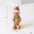 Weihnachtsfigur Lebkuchenmann aus Harz mit roter Mütze und grünem Schal, 12cm hoch - Lebkuchenmann Junge