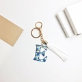 Letter E keychain with blue tropical floral print, white tassel and gold metal hardware - Letter E (With Tassel)