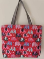 Red canvas tote bag with elephant and heart prints featuring grey carry handles - Deep Pink Elephant