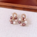 Close-up of 18K gold plated pearl earrings with white pink and purple textured beads - Three-Color Pearl Wraparound Gold Earrings
