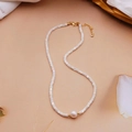 Detailed macro view of white square beads and large round pearl on a 14K gold-plated chain - White Shell Freshwater Pearl Necklace