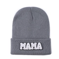 Close-up of grey knitted beanie featuring white MAMA towel embroidery on folded brim - Gray