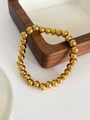 Bracciale minimalista in acciaio al titanio placcato oro 18K con perline rotonde - 7mm / Oro