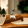 Detail of a Christmas gnome with a knitted star hat and white beard on a tray - Grey Short Leg Style