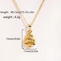 Close-up of golden Christmas tree pendant necklace with precise dimensions and weight details - Green Enamel Christmas Tree