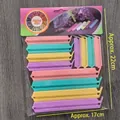 Set of 12 colorful plastic food sealing clips in various sizes in polybag packaging - Set of 12