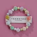 Pastel colored Jingdezhen ceramic beaded bracelet with shell charms on pink background - 1586-01 Colorful Shells