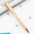 Retractable ballpoint pen in gold floral design with rose gold metallic accents - Style B Big Flower Yellow