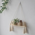 Handmade macrame wall hanging shelf with wood beads and tassels for home plant decor - Tassel Style