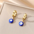 Macro shot of gold evil eye hoop earrings with blue enamel charms on a beige jewelry box - Dark Blue