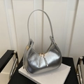 Detail view of silver crescent hobo bag with dual zippers and metallic mirror finish - Silver