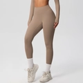 Close-up of high-waist mocha yoga pants and long sleeve top with seamless compression fabric - Mocha Brown