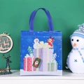 Blue Christmas non-woven gift bag featuring snowmen and reindeer holiday patterns - Blue Gift Box